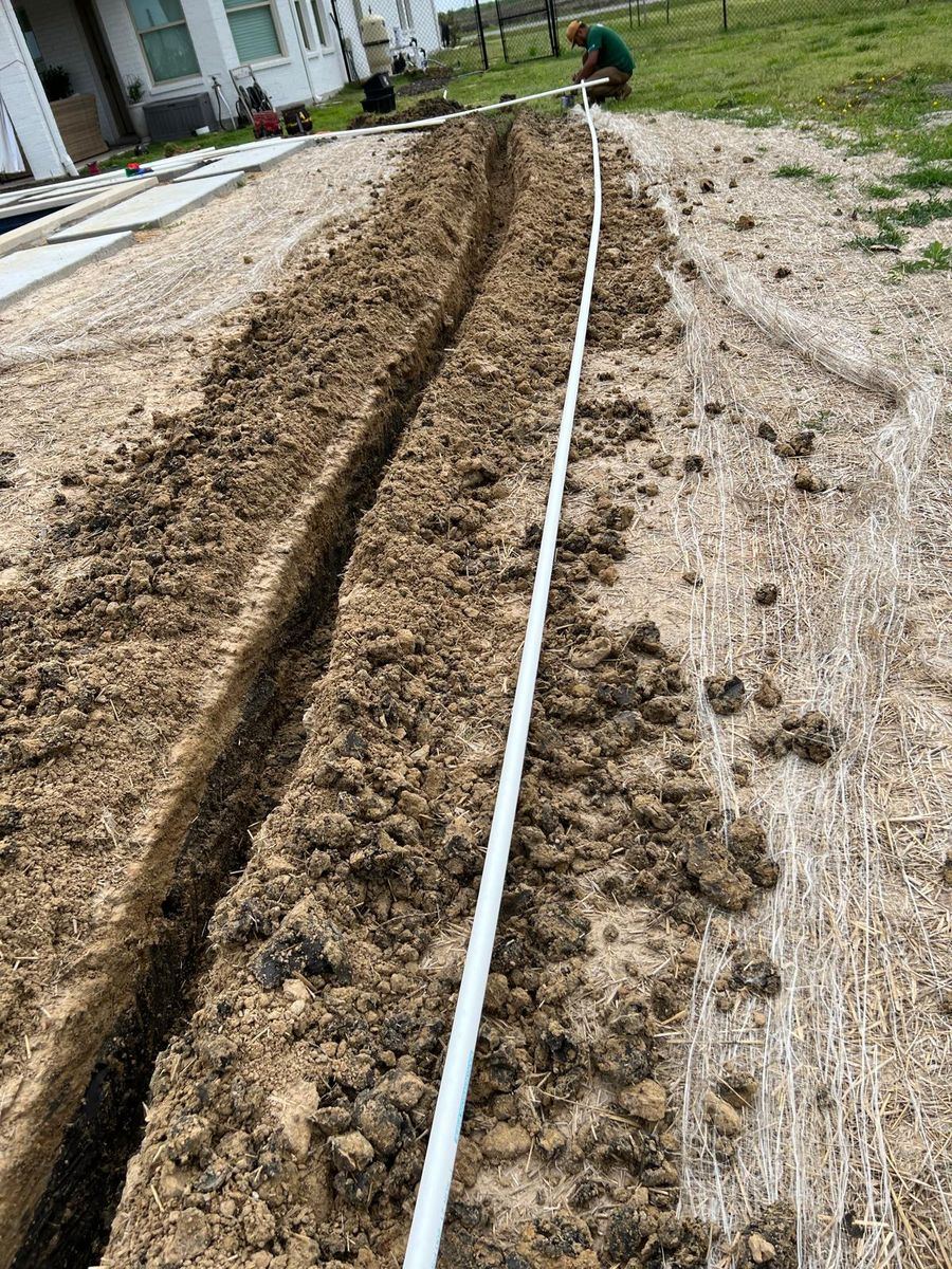 Sprinkler repair technician working on an irrigation system in Frisco TX