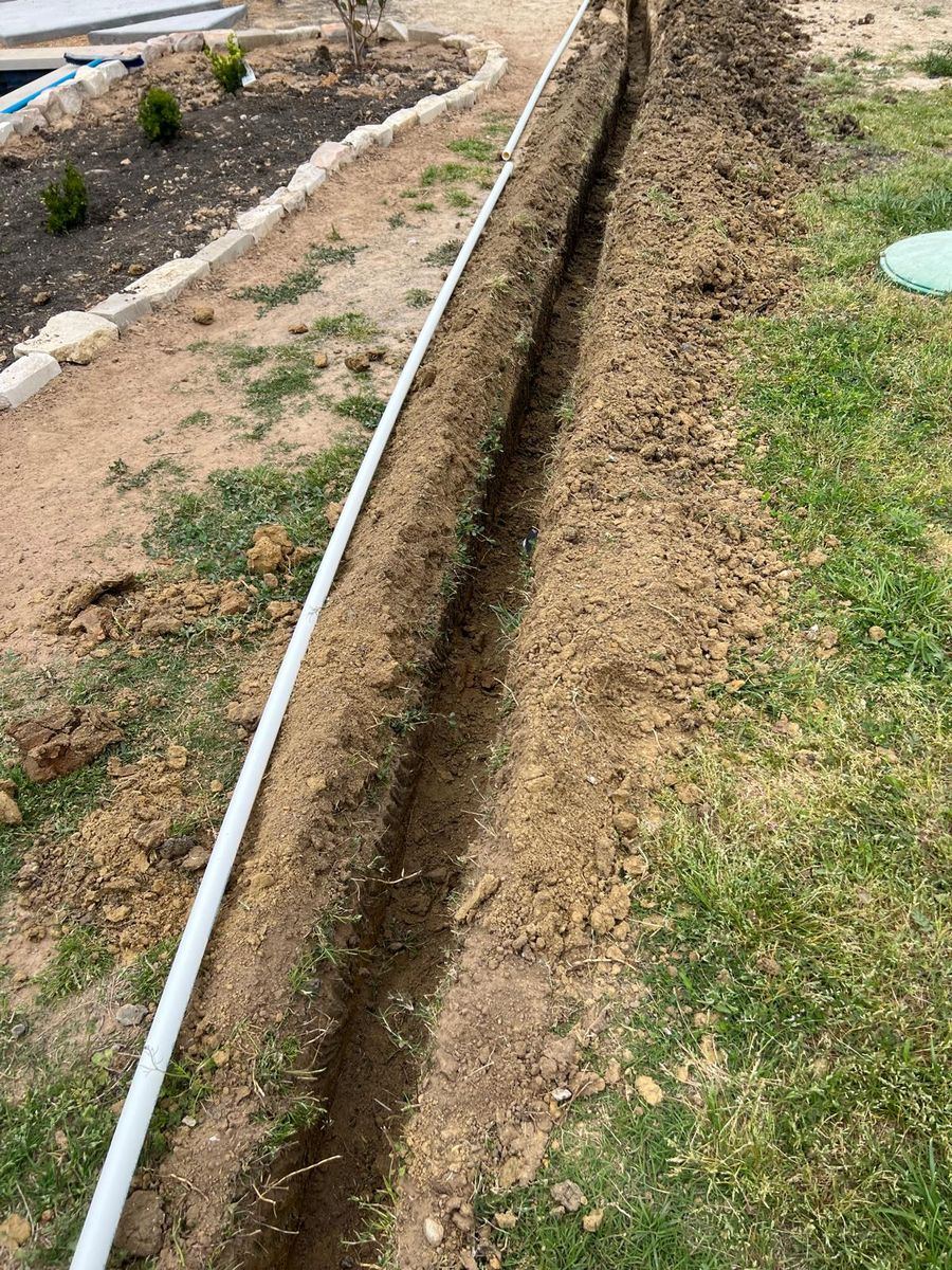 Sprinkler repair technician working on an irrigation system in McKinney TX