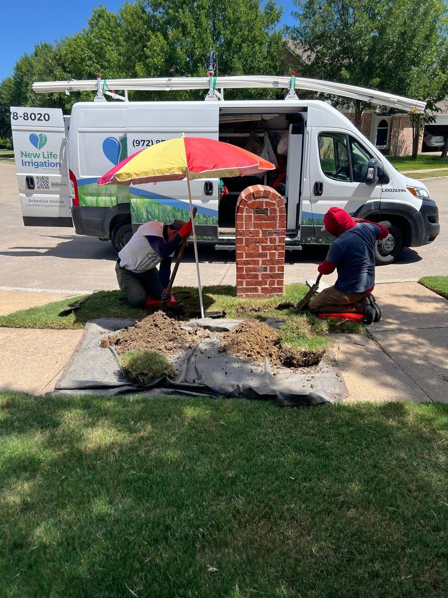Sprinkler repair technician working on an irrigation system in Rowlett TX