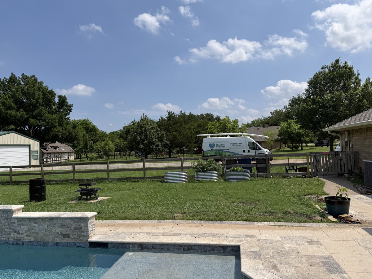 New Life Irrigation service van at a property in Saint Paul TX