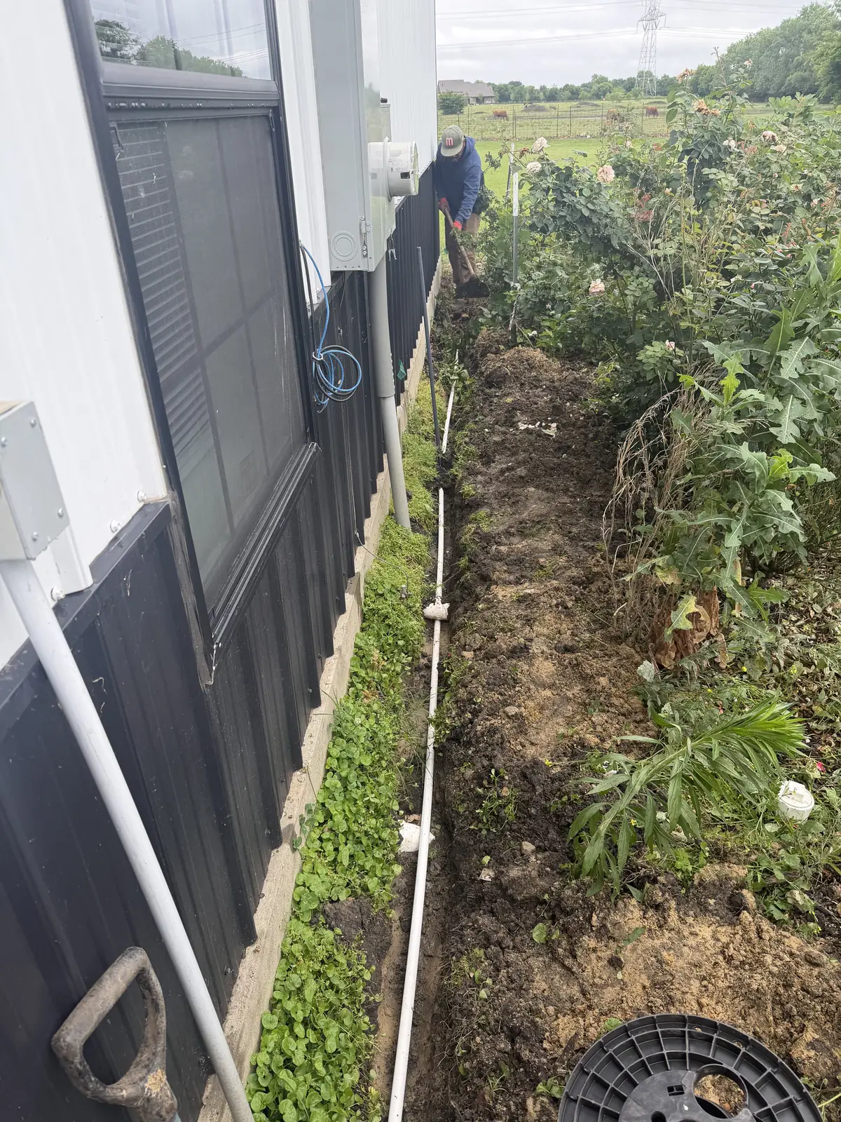 Yard irrigation pipe repair near flower bed in Wylie, TX by New Life Irrigation